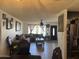 Spacious living room viewed from kitchen, featuring large windows and comfortable seating at 3307 W Ocotillo Rd, Phoenix, AZ 85017