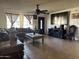 Cozy living room with a large window, ceiling fan and a large, comfortable sectional sofa at 3307 W Ocotillo Rd, Phoenix, AZ 85017
