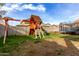 Backyard with a playset and trampoline, perfect for outdoor fun at 3522 E Spring Wheat Ln, Gilbert, AZ 85296