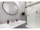 Well-lit bathroom showcasing a shower, toilet, and sink with modern fixtures at 3522 E Spring Wheat Ln, Gilbert, AZ 85296