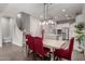 Dining area showcases an elegant table set, open to the kitchen and living spaces at 3522 E Spring Wheat Ln, Gilbert, AZ 85296