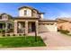 Charming two-story home with stone accents, manicured lawn, and inviting curb appeal at 3522 E Spring Wheat Ln, Gilbert, AZ 85296