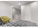 Neutral-colored hallway with chair and view of the staircase at 3522 E Spring Wheat Ln, Gilbert, AZ 85296