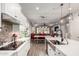 Well-lit kitchen with modern appliances and fixtures, opening to the dining area at 3522 E Spring Wheat Ln, Gilbert, AZ 85296