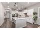 Beautiful open kitchen featuring white cabinetry, stainless appliances, and a stylish central island at 3522 E Spring Wheat Ln, Gilbert, AZ 85296