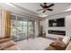 Inviting living room with tile floors, a sectional sofa, and backyard access at 3522 E Spring Wheat Ln, Gilbert, AZ 85296