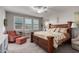 Cozy main bedroom with a large bed, sitting area, and plenty of natural light at 3522 E Spring Wheat Ln, Gilbert, AZ 85296