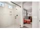Modern shower with glass door, tile surround, and convenient built-in niche at 3522 E Spring Wheat Ln, Gilbert, AZ 85296