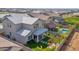 Aerial view of a home showcasing its landscaped backyard, pool, pergola, and neighborhood at 3830 E Appaloosa Rd, Gilbert, AZ 85296