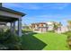 Backyard featuring artificial grass, pavers, and a pergola at 3830 E Appaloosa Rd, Gilbert, AZ 85296