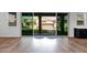 Backyard view through sliding doors showcasing the patio, pergola, and artificial turf lawn at 3830 E Appaloosa Rd, Gilbert, AZ 85296