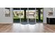 Backyard view through sliding doors showcasing the patio, pergola, and artificial turf lawn at 3830 E Appaloosa Rd, Gilbert, AZ 85296