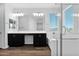 Bright bathroom features a dual sink vanity, soaking tub, and glass-enclosed shower at 3830 E Appaloosa Rd, Gilbert, AZ 85296