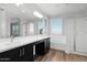 Modern bathroom with dual vanities, soaking tub, and glass shower enclosure at 3830 E Appaloosa Rd, Gilbert, AZ 85296