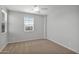 Well lit bedroom with a large window and neutral carpeting at 3830 E Appaloosa Rd, Gilbert, AZ 85296