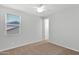 Well lit bedroom with a large window and neutral carpeting at 3830 E Appaloosa Rd, Gilbert, AZ 85296