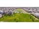 A sprawling community park featuring lush green lawns, mature trees, and a playground in a residential neighborhood at 3830 E Appaloosa Rd, Gilbert, AZ 85296