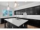 Kitchen island featuring light countertops and stainless steel faucet at 3830 E Appaloosa Rd, Gilbert, AZ 85296