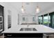 Open kitchen island view featuring sink with backyard view and modern pendant lighting at 3830 E Appaloosa Rd, Gilbert, AZ 85296