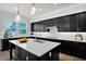 Modern kitchen featuring a center island, stainless steel appliances, and quartz countertops at 3830 E Appaloosa Rd, Gilbert, AZ 85296