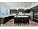 Modern kitchen with dark cabinets, white countertops, a center island, and stainless steel appliances at 3830 E Appaloosa Rd, Gilbert, AZ 85296