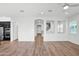 Open concept living space with wood floors, recessed lighting and direct kitchen access at 3830 E Appaloosa Rd, Gilbert, AZ 85296