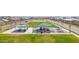 Aerial view of a community playground with covered picnic areas, play structures, and an open grassy field at 3830 E Appaloosa Rd, Gilbert, AZ 85296