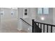 Carpeted staircase with black handrail and natural lighting from above at 3830 E Appaloosa Rd, Gilbert, AZ 85296