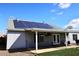 A covered patio and modern solar panels accent this property's backyard at 4631 W Mcrae Way, Glendale, AZ 85308