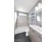This stylish bathroom features tile floors, a shower/tub combo, and a modern vanity at 4631 W Mcrae Way, Glendale, AZ 85308