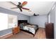 Bedroom with a ceiling fan and wooden floors at 4631 W Mcrae Way, Glendale, AZ 85308