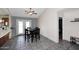 Dining area with tile floors, a ceiling fan and a view to the back at 4631 W Mcrae Way, Glendale, AZ 85308