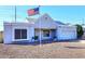 Charming single-story home with a well-maintained yard and a prominent American flag at 4631 W Mcrae Way, Glendale, AZ 85308