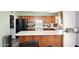 Kitchen view with stainless steel refrigerator and wooden cabinets at 4631 W Mcrae Way, Glendale, AZ 85308