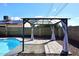 This beautiful backyard features a sparkling pool, a gazebo, and privacy walls at 4631 W Mcrae Way, Glendale, AZ 85308