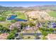 Luxury community featuring a golf course, lush landscaping, and desert views at 4695 N 204Th Ave, Buckeye, AZ 85396