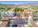Community aerial view features shops, tree-lined streets, homes, and scenic mountain views at 4695 N 204Th Ave, Buckeye, AZ 85396