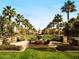 Beautiful fountain at community park lined with palm trees and park benches at 4695 N 204Th Ave, Buckeye, AZ 85396