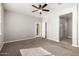 Spacious main bedroom featuring carpeted floors and an ensuite bathroom at 4695 N 204Th Ave, Buckeye, AZ 85396