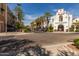 Shopping center on a brick paved street with Main Market building and palm trees at 4695 N 204Th Ave, Buckeye, AZ 85396