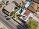 Aerial view of a home with a sparkling pool, well-maintained landscaping, and a durable tile roof at 5202 E Marconi Ave, Scottsdale, AZ 85254