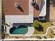 This aerial shot highlights a pool in a backyard, with a tile roof and trees nearby at 5202 E Marconi Ave, Scottsdale, AZ 85254