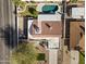 This home's backyard features a sparkling pool, an expansive patio, and a well-maintained tile roof at 5202 E Marconi Ave, Scottsdale, AZ 85254