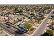 This aerial captures a home with a white fence, desert landscaping and an established neighborhood at 5202 E Marconi Ave, Scottsdale, AZ 85254