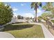 Beautiful backyard featuring lush green grass, mature trees, and privacy walls for outdoor enjoyment at 5202 E Marconi Ave, Scottsdale, AZ 85254