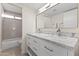 Elegant bathroom with a double sink vanity, marble countertop, and modern fixtures at 5202 E Marconi Ave, Scottsdale, AZ 85254