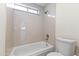 Clean bathroom featuring a tiled shower and updated showerhead at 5202 E Marconi Ave, Scottsdale, AZ 85254