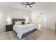 Bright bedroom featuring a ceiling fan, stylish rug, and an ensuite doorway at 5202 E Marconi Ave, Scottsdale, AZ 85254