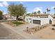 Charming single-Gathering home with a well-manicured lawn, desert landscaping, and a two-car garage at 5202 E Marconi Ave, Scottsdale, AZ 85254