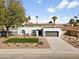 Beautiful single-Gathering home featuring a well-kept lawn, desert landscaping, and a convenient two-car garage at 5202 E Marconi Ave, Scottsdale, AZ 85254